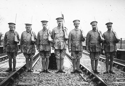 Trumpington Volunteer Training Corps guarding the railway line over the river bridge �Somewhere in Cambs.�, November 1915. These photographs by �Haslop, Trumpington�, were reproduced in Cambridge Chronicle, 17 November 1915, p. 7. Percy Robinson collection. Left to right: 1) W.R. Haslop; 2) T.H.J. Porter; 3) P.J. Collins; 4) Sergt P.R. Robinson; 5) F.W. Lander; 6) I. Parker; 7) R. Haslop.