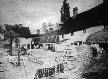 Cottages and yard, thought to be Whitlock�s in the 1880s. Percy Robinson and Cambridgeshire Collection.
