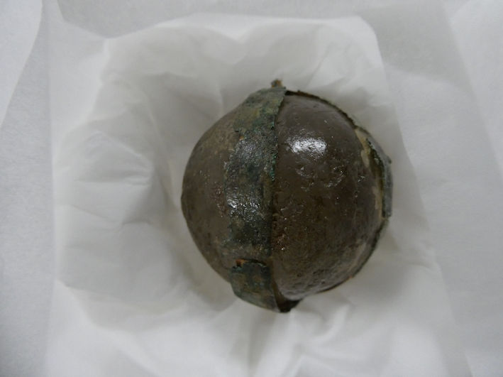 Crystal ball bound with strips of copper alloy, Anglo-Saxon grave good, found at Dam Hill, Trumpington (1934.864), the Centre for Material Culture. Photo: Andrew Roberts, 4 August 2026.
