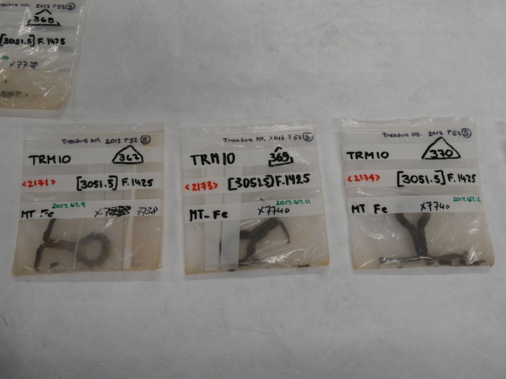 Iron eyelets, parts of the fittings of the bed burial found at Trumpington Meadows (2017.67.9, 11, 12), the Centre for Material Culture. Photo: Andrew Roberts, 4 August 2026.