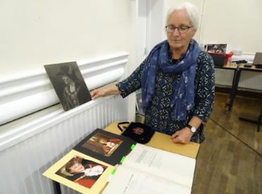 Philippa Slatter at the Local History Group meeting about local Mayors, talking about Eva Hartree, with the Council minute book for 1925, the Mayor's handbag, and photographs of mayors. Photo: Andrew Roberts, 26 September 2019.