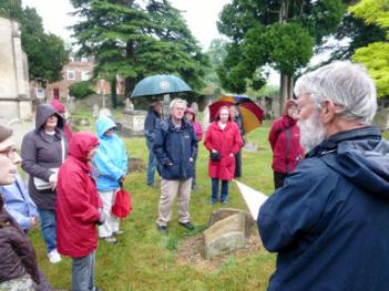 Howard Slatter talking to the group during the Local History walk around the churchyard, Look Who's Buried Here, 27 June 2013. Photo: Martin Jones.