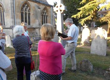 Howard Slatter talking to participants during the Trumpington Local History Group walk around the churchyard. Photo: Andrew Roberts, 30 June 2015.
