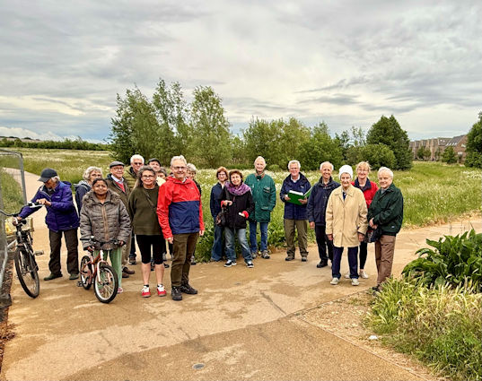 Participants on the Local History Group walk from Hobson Square to Long Road, at the stop in Hobson’s Park. Photo: Jo Sear, 5 June 2025.