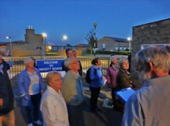 Howard Slatter talking to participants at the entrance to Fawcett School, Trumpington Local History Group walk. Photo: Martin Jones, 10 September 2015.