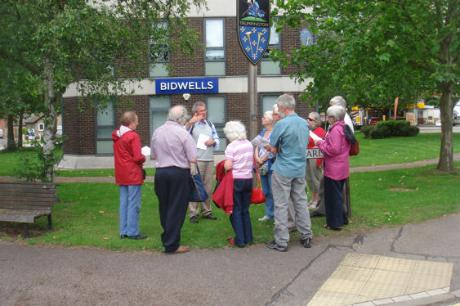 Andrew Roberts talking at the Village Sign, Local History Group walk. Photo: Philippa Slatter, 1 July 2012.