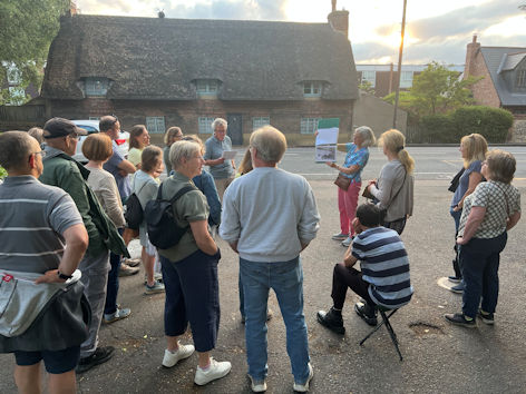 Andrew Roberts talking to the group on the High Street, Local History Group walk, 29 June 2023. Photo: Janelle Robbins.