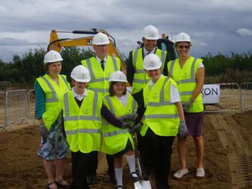 Turf-cutting ceremony at the start of construction of Trumpington Meadows Primary School: teachers Judith Osler (left) and Jo Chrich (right), County Councillor John Powley and children. Photo: Jenny Blackhurst, 10 September 2012.