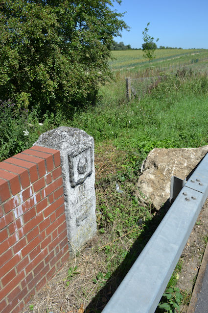 The fourth Trinity Hall milestone, beside the A10 and the river bridge at Hauxton Mill. Photo: Andrew Roberts, 26 June 2011.