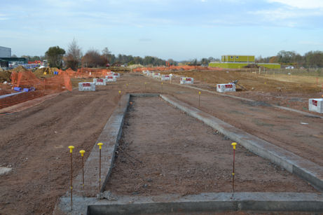 Construction work on the Trumpington Meadows access road from the Hauxton Road junction, with the John Lewis building to the left. Photo: Andrew Roberts, 24 November 2011.