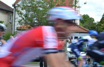 The peloton passing on Shelford Road. Photo: Andrew Roberts, 7 July 2014.
