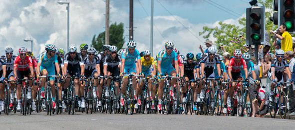 The peloton coming over the railway bridge on Shelford Road. Photo: Stephen Brown, 7 July 2014.