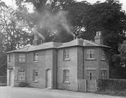 The Toll House and Weighbridge House in the 1920s. Percy Robinson (stop 2).