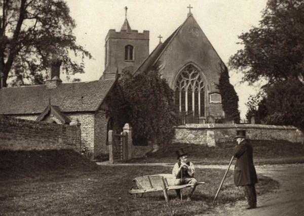 Grantchester Church from the east, 1874-75: with John Benton on a wheelbarrow and William Loughton standing, photograph by Samuel Page Widnall. Source: Christine Jennings (stop 6).