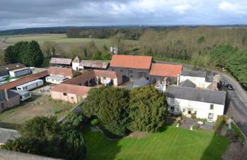 Looking from Trumpington church tower south west over Anstey Hall Farm with the barns and dovecote on the further side of the farm. Photo: Andrew Roberts, 7 April 2012.