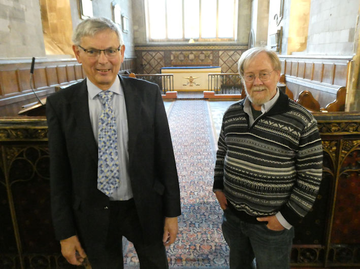 Edmund Brookes and David Newcombe standing by the rood screen at the Local History Group meeting in Trumpington Church. Photo: Andrew Roberts, 7 May 2026.