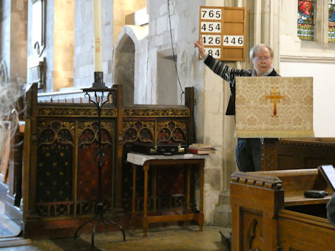 David Newcombe speaking at the Local History Group meeting in Trumpington Church, in front of the rood screen. Photo: Andrew Roberts, 7 May 2026.