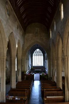 Looking along the Nave to the Chancel and east window from the organ loft, Trumpington Church. Photo: Andrew Roberts, October 2011.