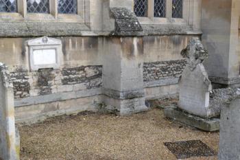 The Hurrell plaque on the church wall and Maris family headstone and coped stone, with ground slab to rear (entry 17 and 18). Photo: Andrew Roberts, 27 October 2013.