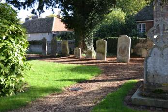 The Bland family headstones lining the path near the eastern boundary (entry 31). Photo: Andrew Roberts, 27 October 2013.