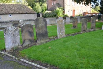 The line of Nichols family headstones to the north east of the chancel (entry 3). Photo: Andrew Roberts, 28 October 2013.