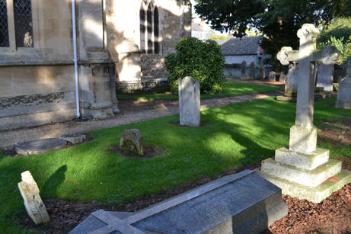 The Edleston family headstone horizontal by the path, Haslop family headstone in the centre and Constable family cross to the left (entry 29, 30 and 28). Photo: Andrew Roberts, 28 October 2013.