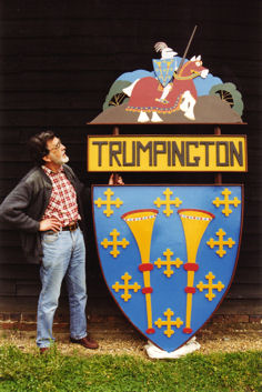 Peter Dawson standing alongside the renovated original sign. Photo: Peter Dawson, 1998.